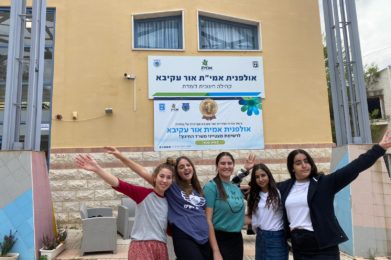 Students in front of sign